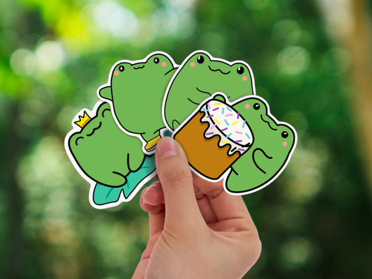 Set of 4 cute kawaii frog stickers showing different activities: drumming, sitting on lily pad, ice skating, and sitting