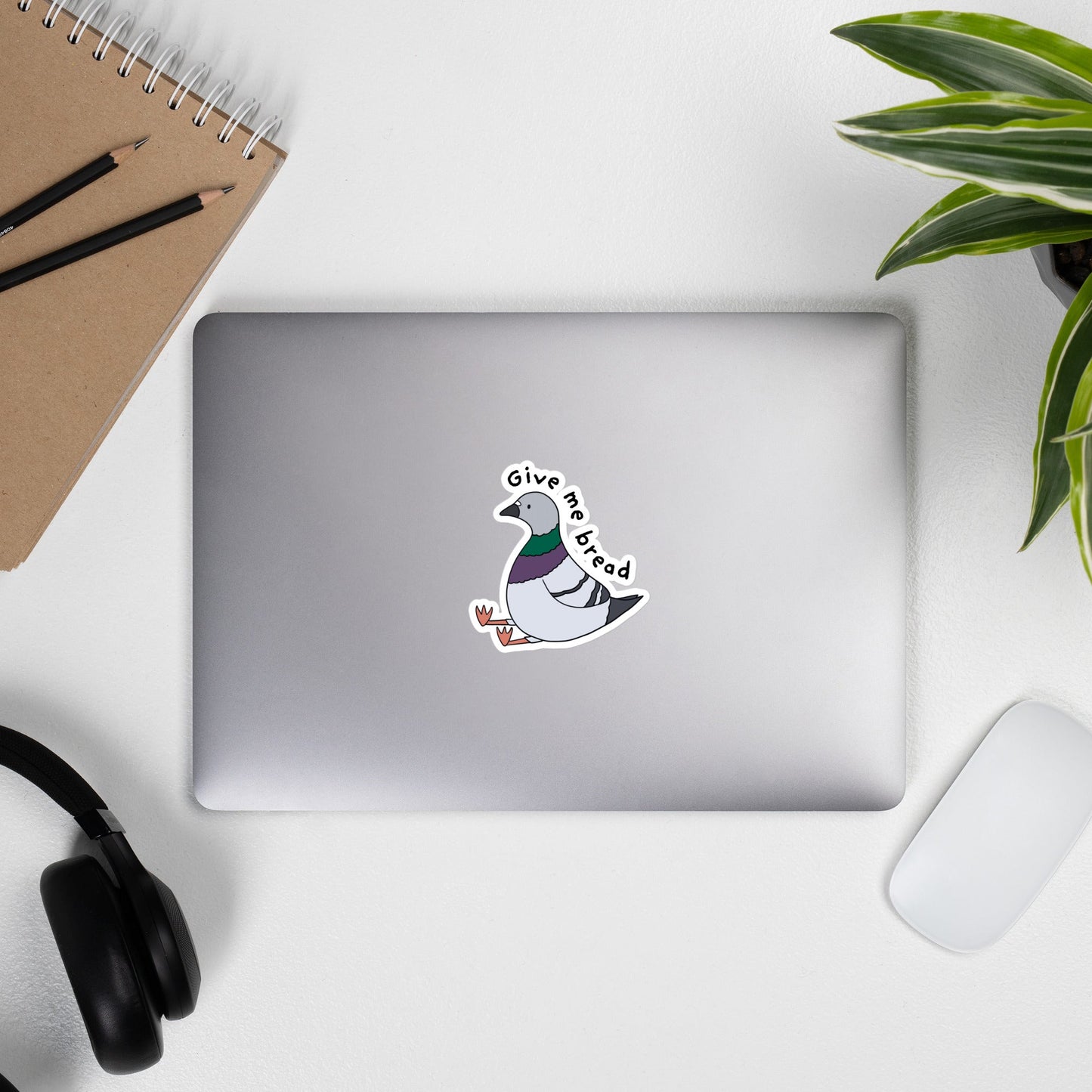 Funny pigeon sticker. Pigeon sitting down with legs out front. 