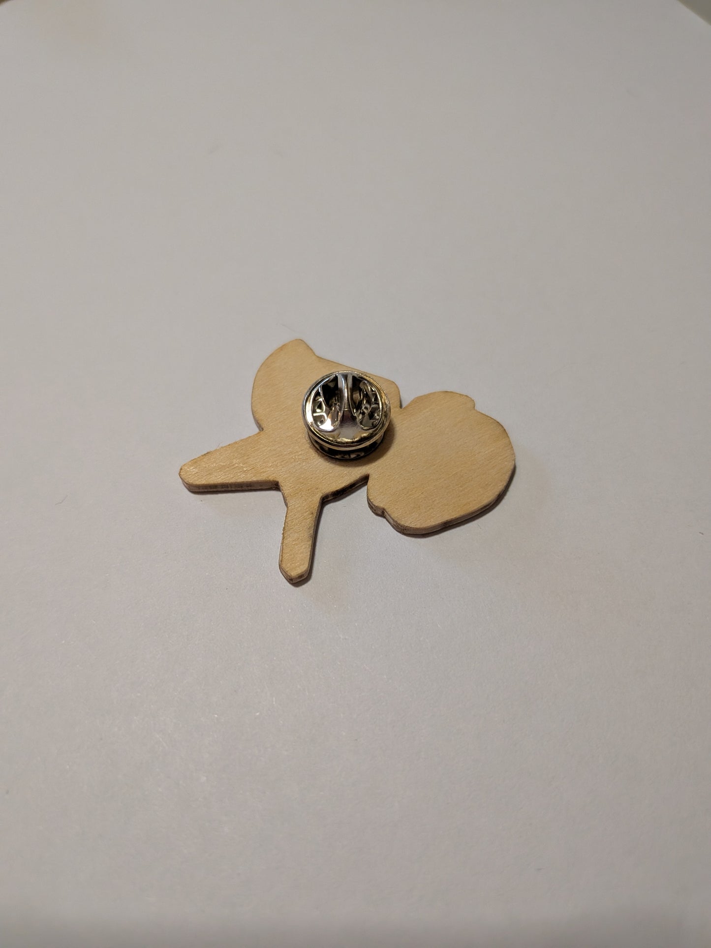 home made eco friendly wooden pin with a heart and an arrow, and the quote by Heathcliff towards Cathy "haunt me then. Be with me always. Take any form. Drive me mad."

Inspired by Wuthering Heights